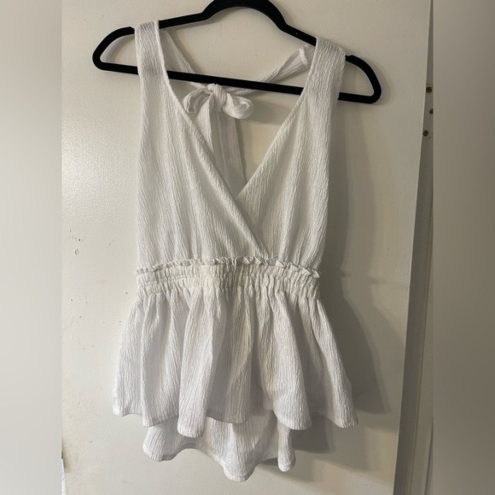 White Sleeveless Peplum Top